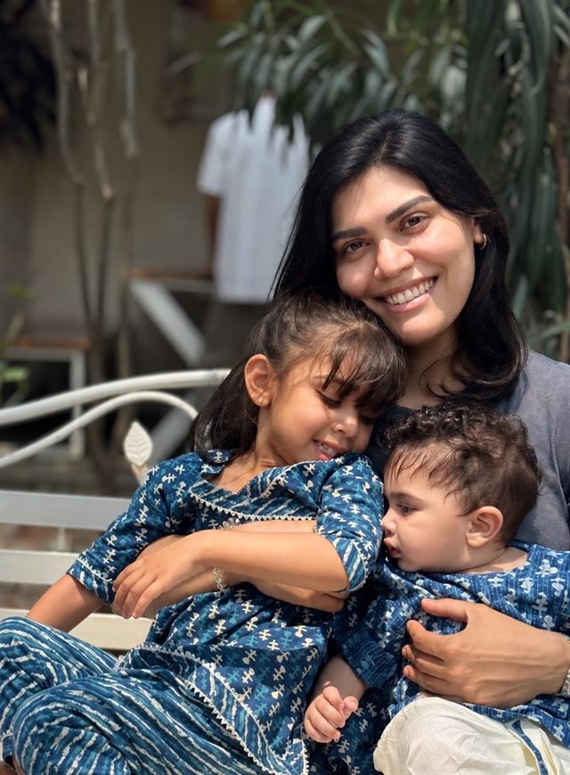 Yuvarekha Sampath, founder of Paramparā, smiling with her two young children